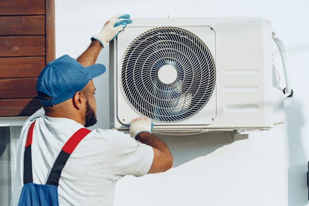 repairman in uniform installing the outside unit o 2021 09 03 18 54 04 utc 1